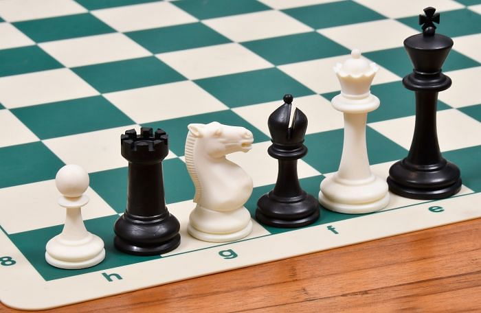 Black And White Pieces With Notation Of Plastic Roll Up Chess Board