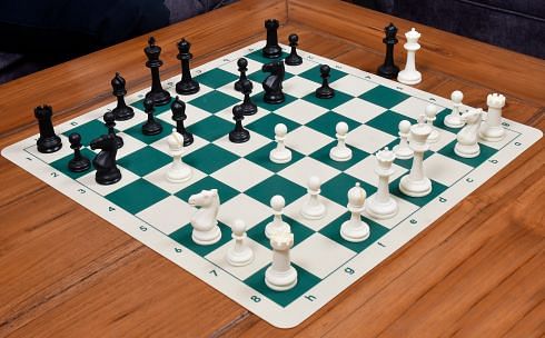 Plastic Chess Pieces on a roll up chess board