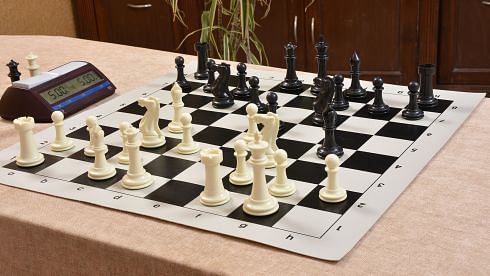 Plastic chess pieces in Black Dyed & Ivory White
